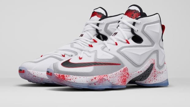 White, red, and black Nike LeBron shoes.